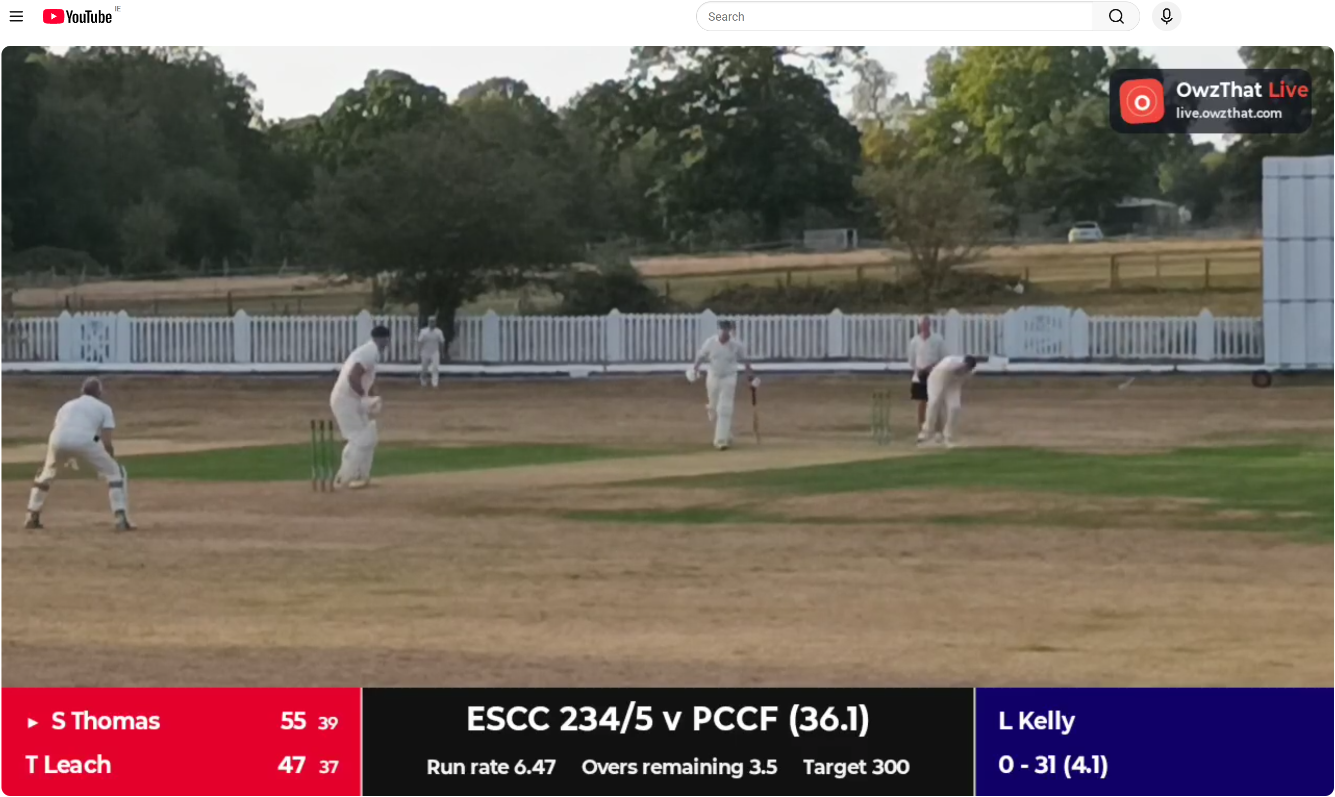 OwzThat Live cricket broadcast with an on-screen score overlay showing batters, bowler, team total and overs.